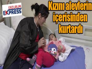 Kızını alevlerin içerisinden kurtardı