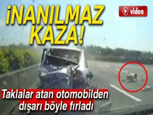 Taklalar atan otomobilden dışarı fırladı