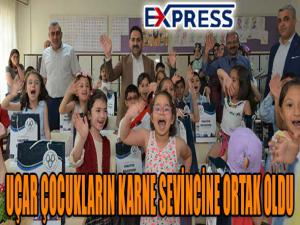 UÇAR ÇOCUKLARIN KARNE SEVİNCİNE ORTAK OLDU